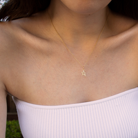 Woman wearing the Baby Hollow Diamond Star Necklace