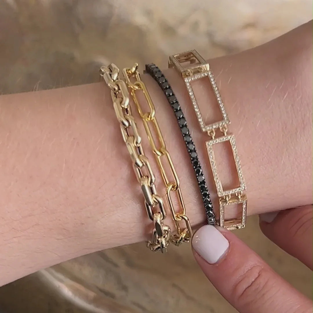 video of the 2MM black diamond tennis bracelet, the Open Bar Tennis Bracelet, the Chubby Diamond Link Bracelet, and the Eternity Bracelet