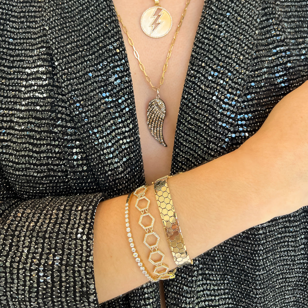 Close Up of arm wearing the Liquid Prism Bracelet, the 24/7 Diamond Bangle, and the Prism Tennis Bracelet