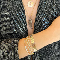 Close Up of arm wearing the Liquid Prism Bracelet, the 24/7 Diamond Bracelet, and the Prism Tennis Bracelet