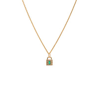 Baby Emerald Lock Necklace: A 14K gold necklace featuring an emerald and diamond pendant in a lock and key setting.