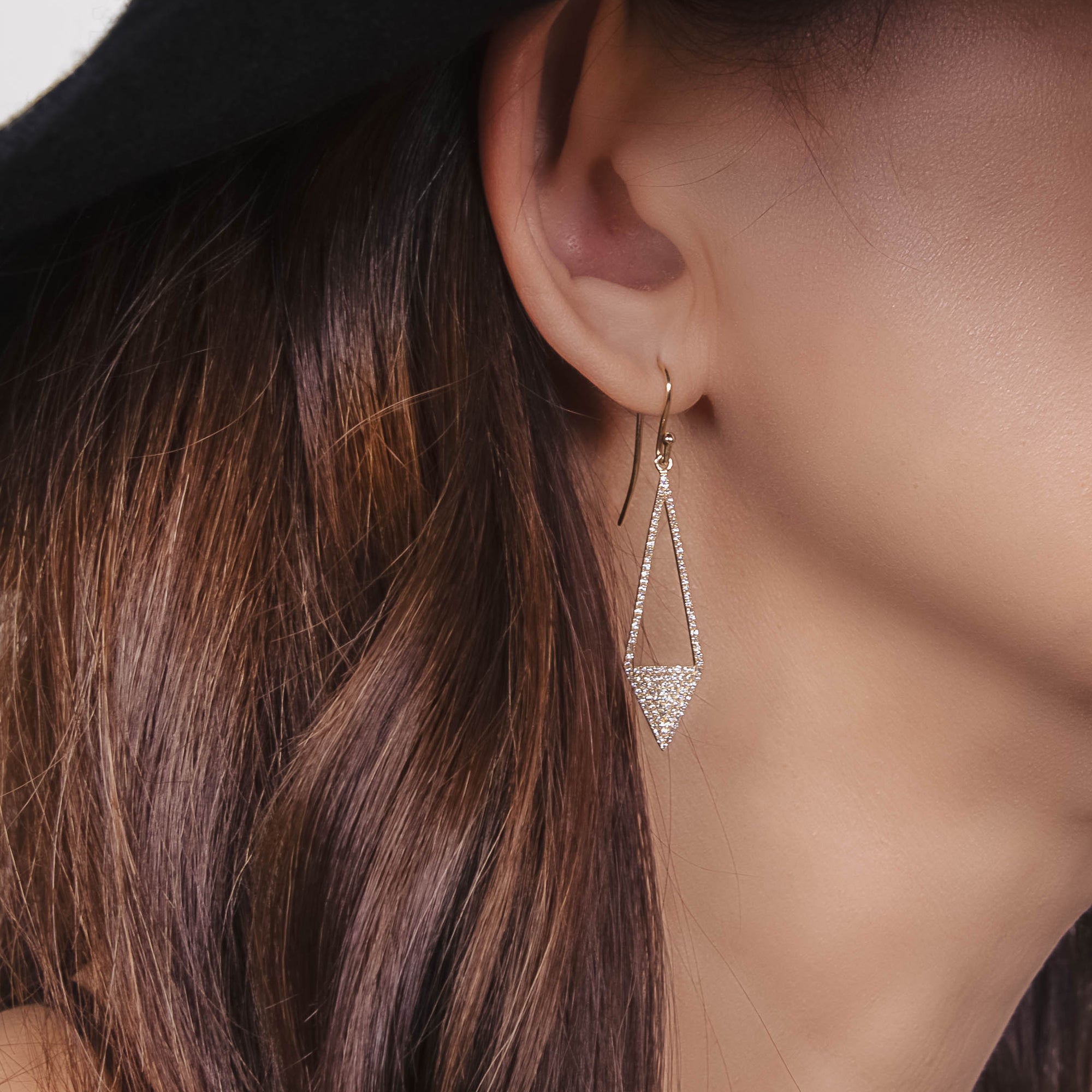 Diamond Arrow Earrings on the ear
