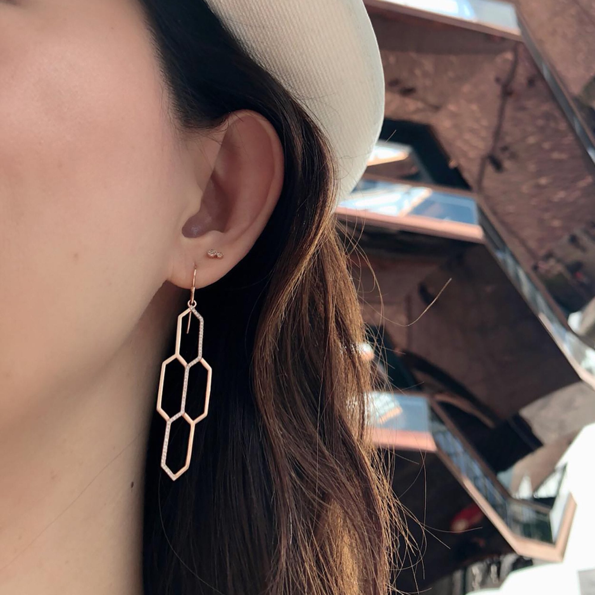 Woman wearing the Diamond Honeycomb Earrings and the Diamond Double Dot Studs