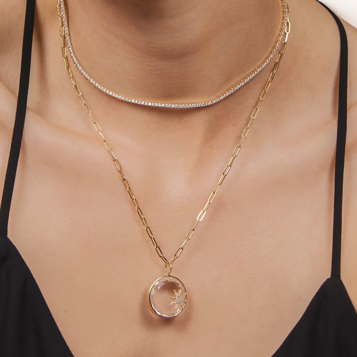 Woman wearing the Diamond Tennis Necklace, and the Crystal Galaxy Necklace