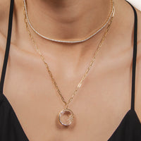 Woman wearing the Diamond Tennis Necklace, and the Crystal Galaxy Necklace