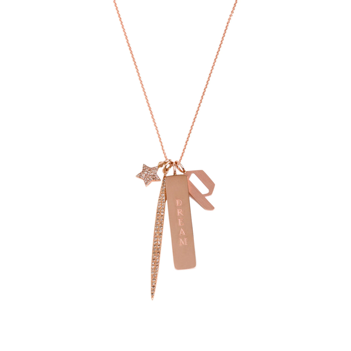 A charm neckalce that includes the Dog Tag engraved with the word "DREAM", the Small 'p' Alphabet Pendant, the 2 inch Pave Diamond Spear Pendant