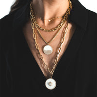 MOTHER-OF-PEARL BALANCE MEDALLION