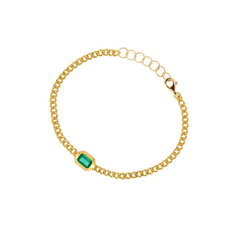 Emerald Bracelet: A 14K gold bracelet with a baguette emerald featuring a lobster clasp fastening.
