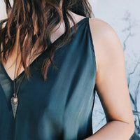 woman wearing the Large Black Diamond Heart and Starburst Diamond Necklace