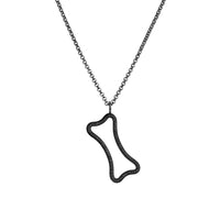 Large Hollow Black Diamond Dog Bone Necklace: A hollow diamond pendant in the outline of a dog bone, embedded in black diamonds, on a chain