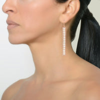 Long Diamond Pearl Bar Earrings on a model