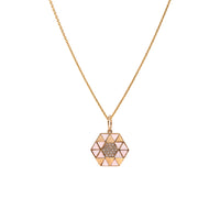 Pink Opal Symmetry Necklace: A yellow gold pendant featuring a geometric pattern with pink opal and diamond accents on a chain.