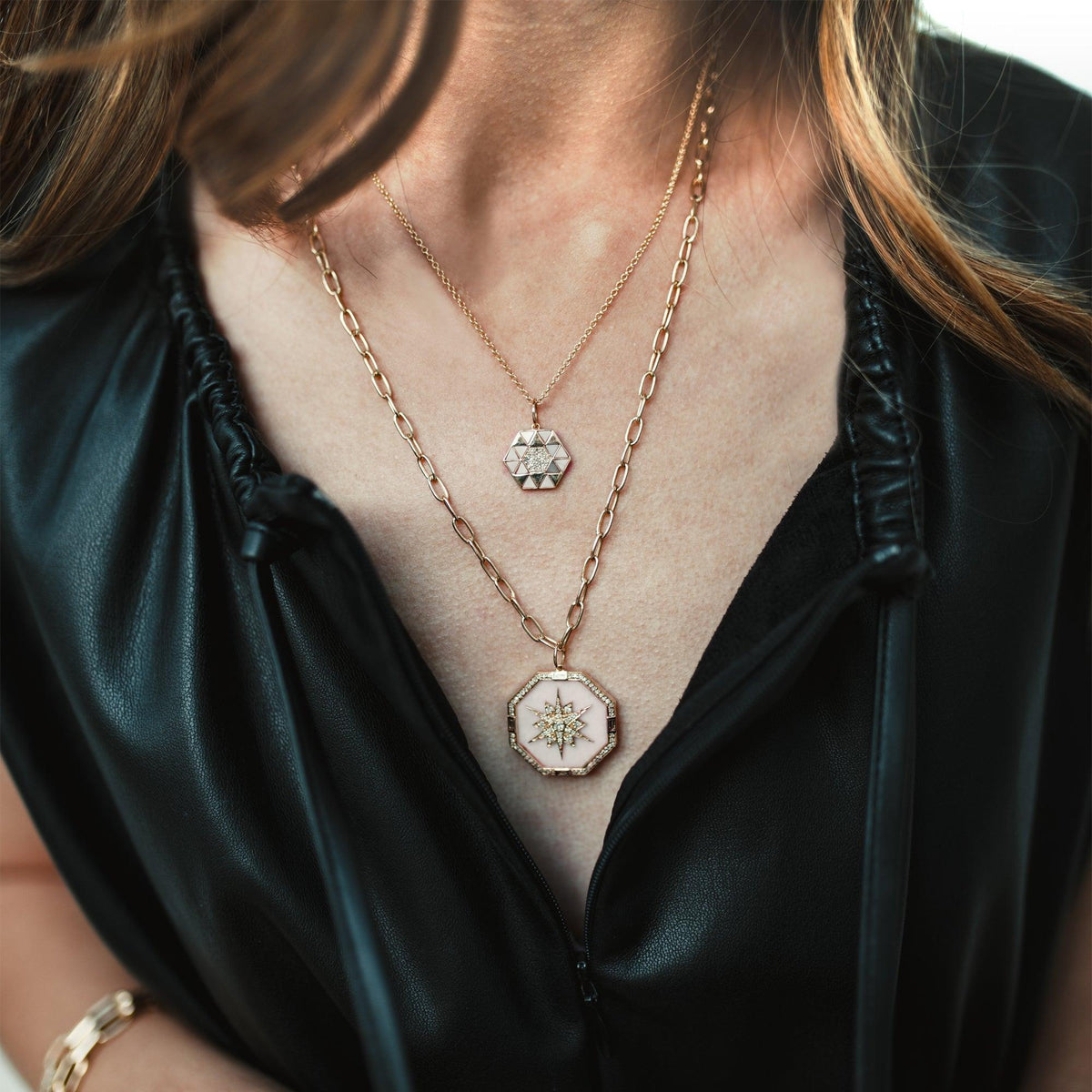 Close up of woman wearing the Pink Opal Symmetry Necklace and the Pink Opal Octagon Medallion Necklace