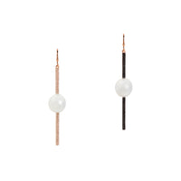 Reversible Diamond and Pearl Stick Earrings: a pair of 14K gold diamond stick earrings with a pearl in the center of each, both are reversible with white diamonds on one side and black diamonds on the other