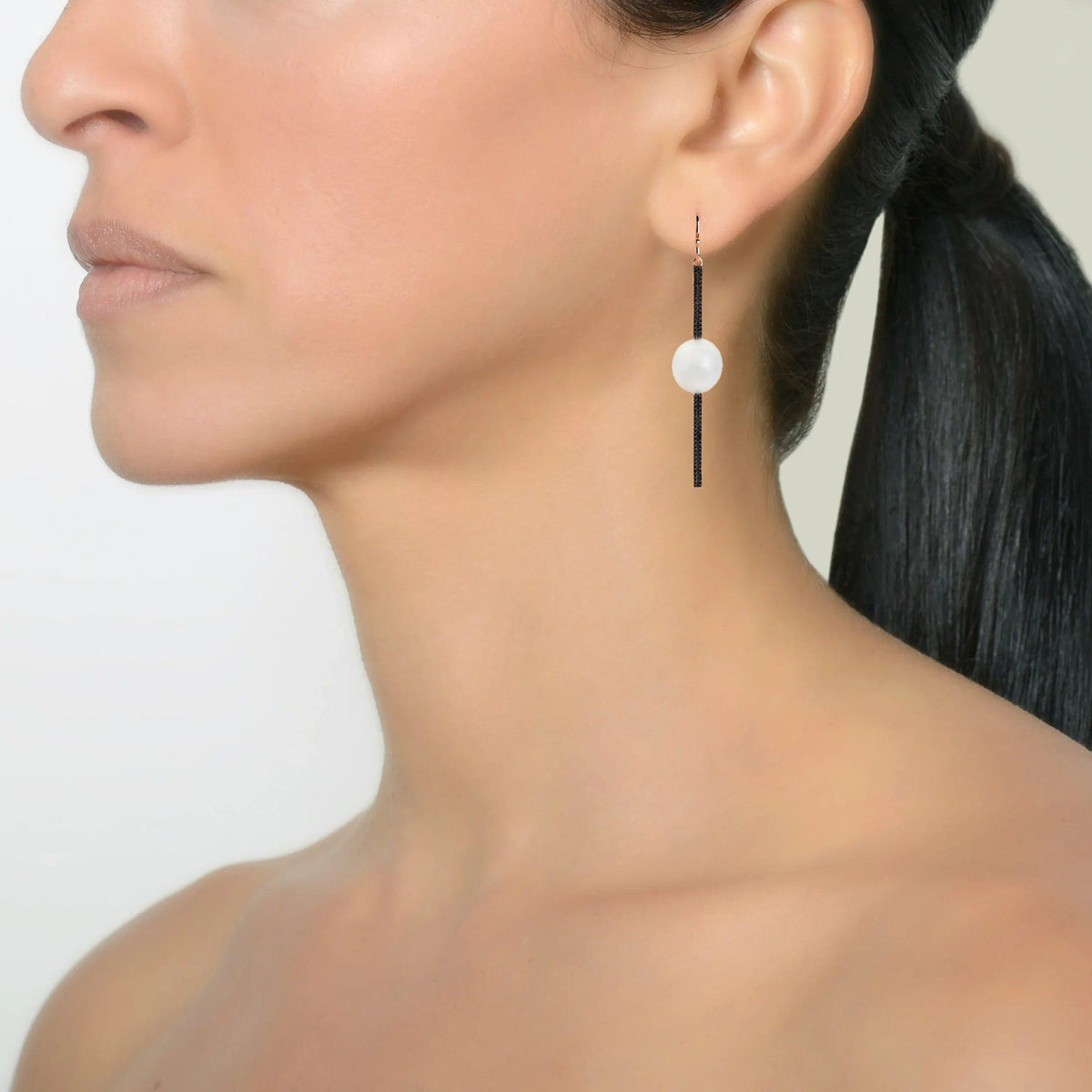 Reversible Diamond and Pearl Stick Earrings on a model