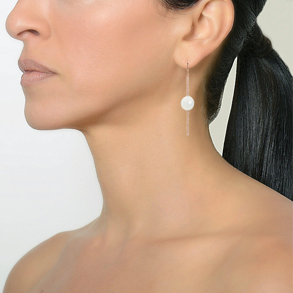 Reversible Diamond and Pearl Stick Earrings on a model