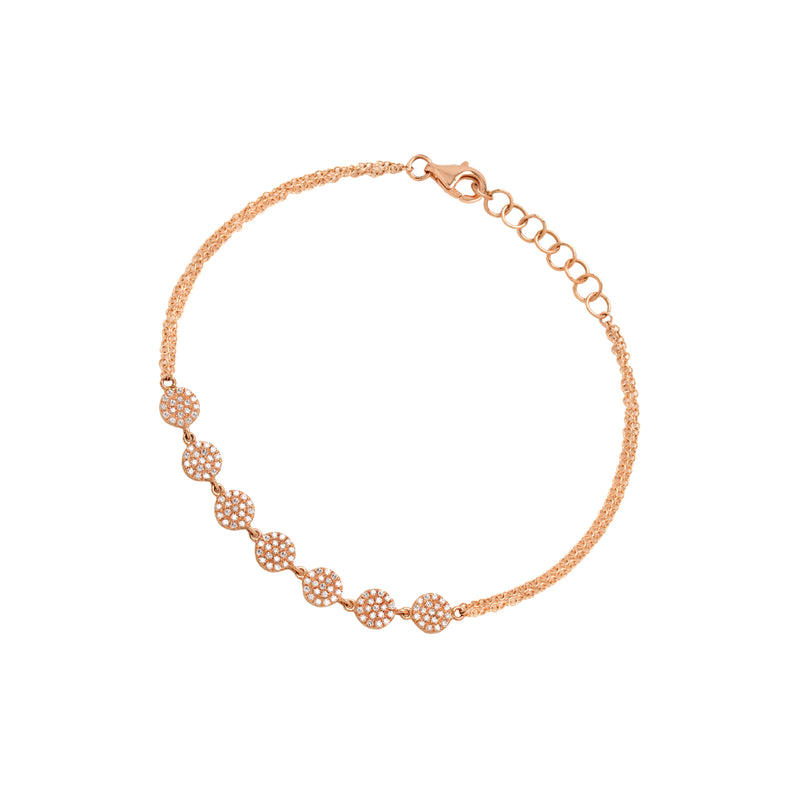 Rose Gold 7-Dot Diamond Bracelet: A 14K gold bracelet with diamond dots, featuring a lobster clasp fastening.