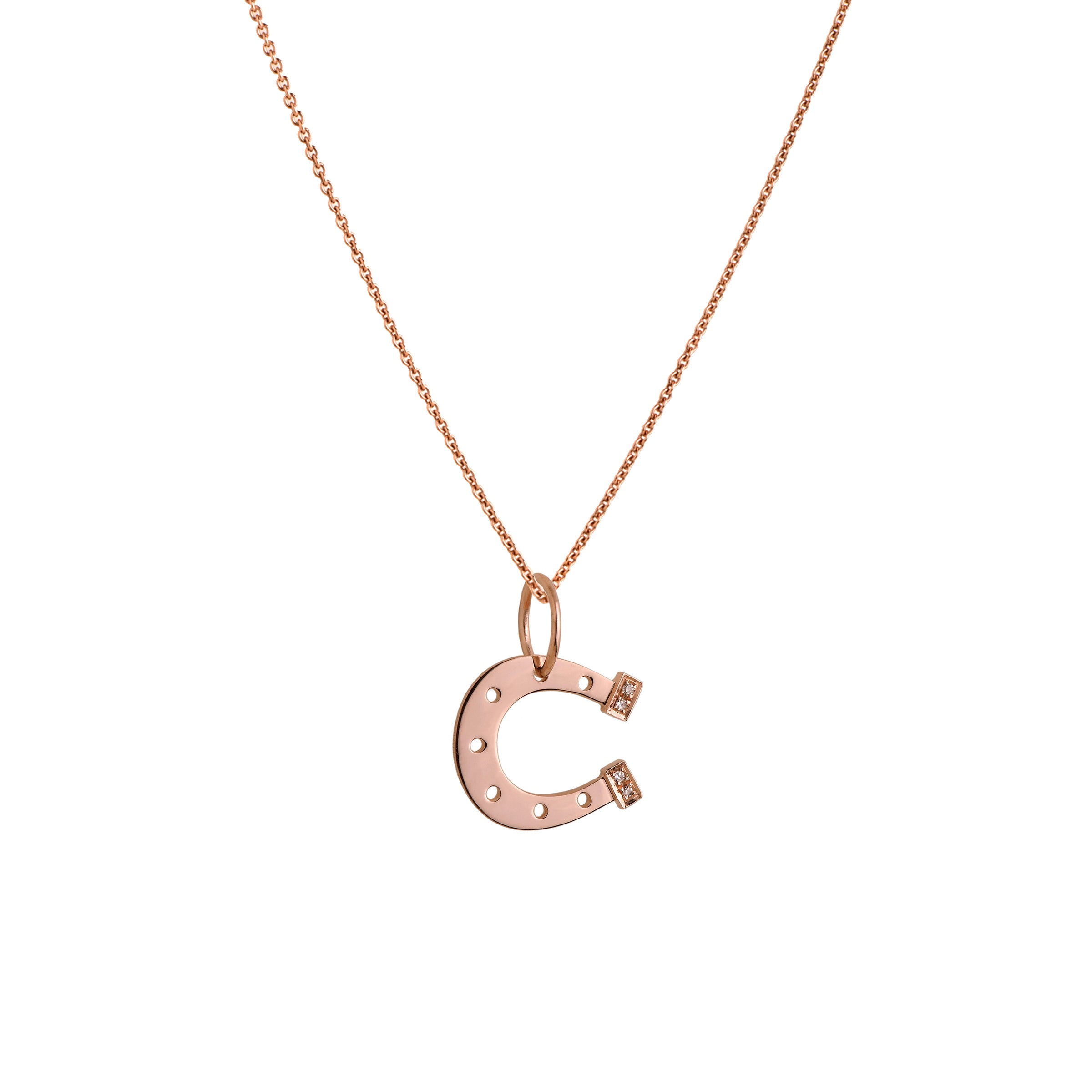Rose Gold Horseshoe Necklace: A 14K gold horseshoe-shaped pendant with small diamond heels on a chain.