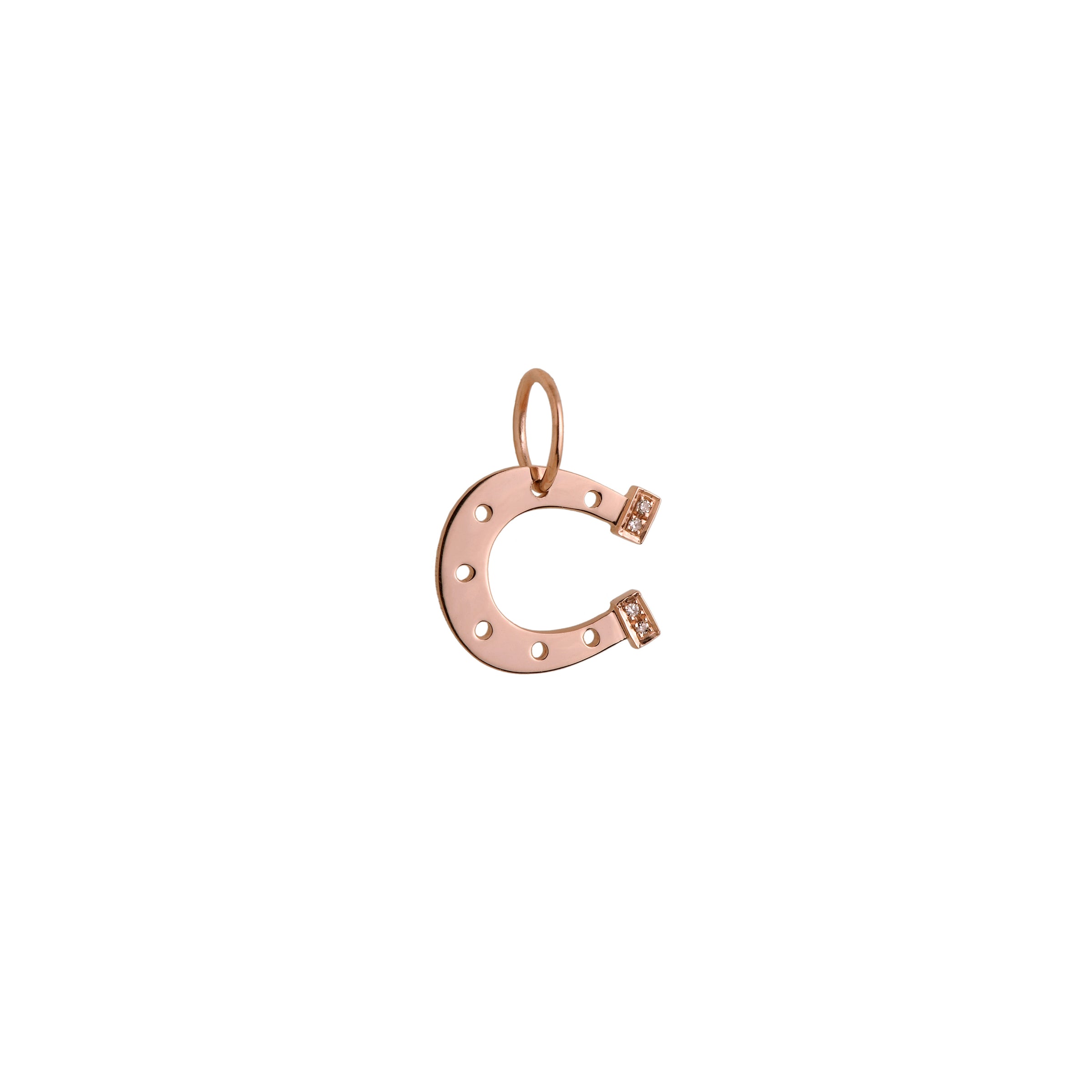 Rose Gold Horseshoe Pendant: A 14K gold horseshoe-shaped pendant with small diamond heels.