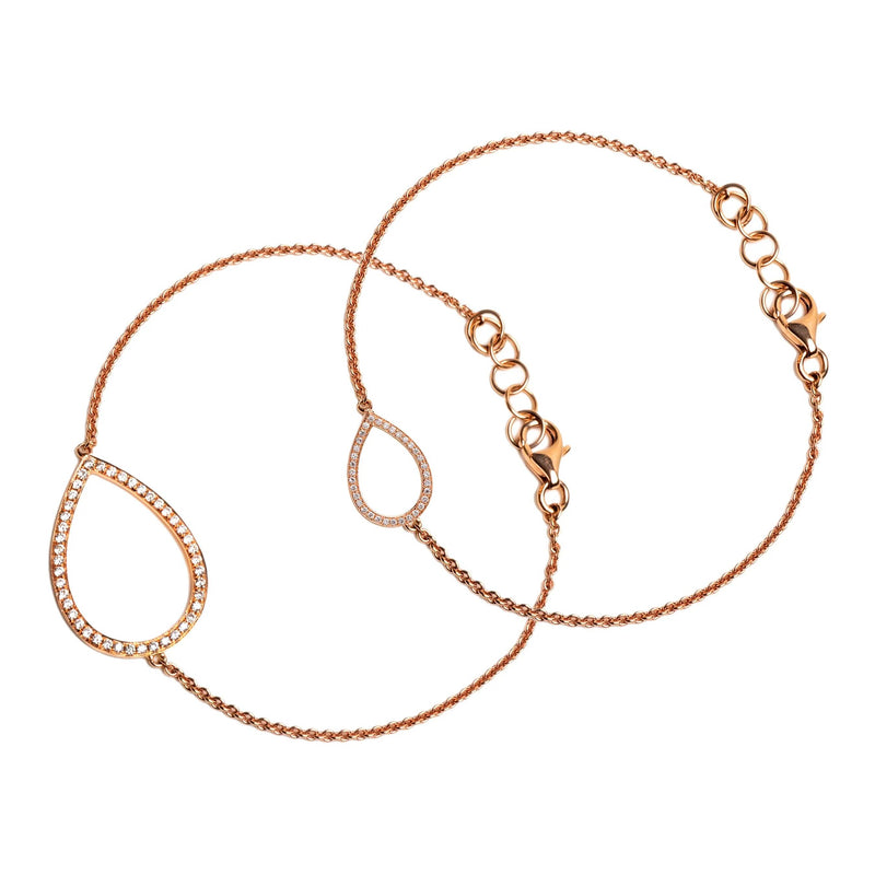 Rose Gold Me & Mini Me Bracelet Set: Two gold bracelets with diamond accents with teardrop shape centers, both with lobster clasps.