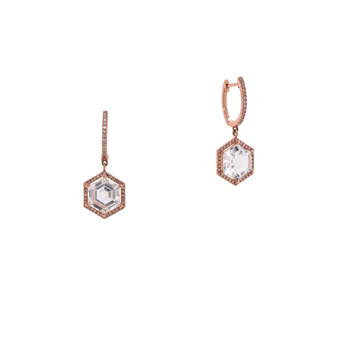 Rose Gold Prism Hexagon Earrings: A pair of 14K gold earrings featuring drops of a white topaz gemstone in a hexagonal setting with smaller diamonds around it, attached to hinged huggies