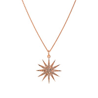 Yellow Gold Starburst Diamond Necklace: A 14K gold pendant featuring a starburst-shaped design with diamonds, on a chain.