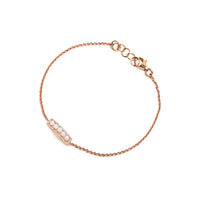 Short Pearl Bar Bracelet: A 14K gold bracelet featuring a bar of pearl beads surrounded by diamonds and a lobster clasp fastening.