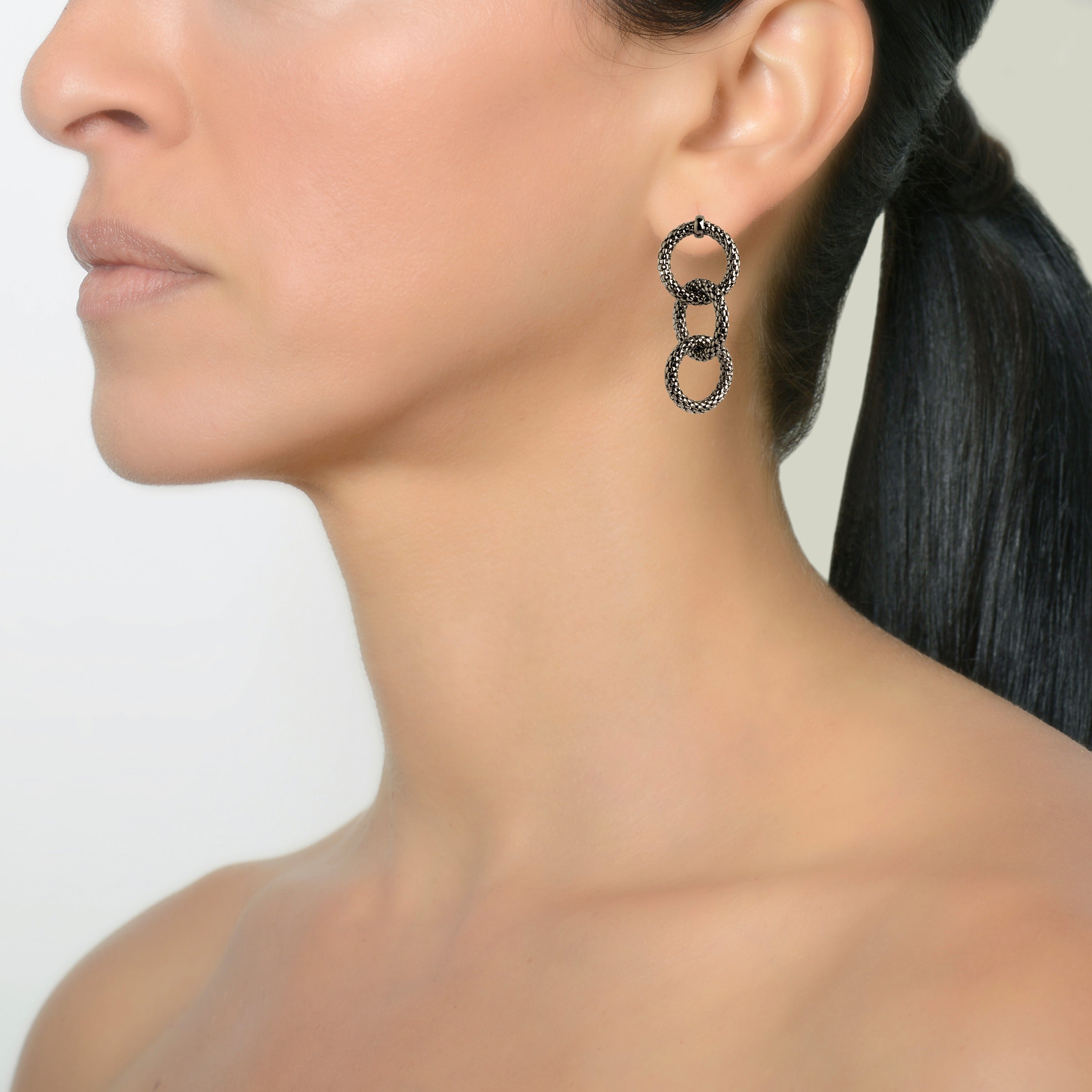 Silver Triple Link Mesh Earrings on a model