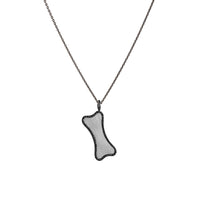 Small Black Diamond Dog Bone Necklace: A sterling silver diamond pendant in the shape of a dog bone, surrounded by black diamonds, displayed on a chain.
