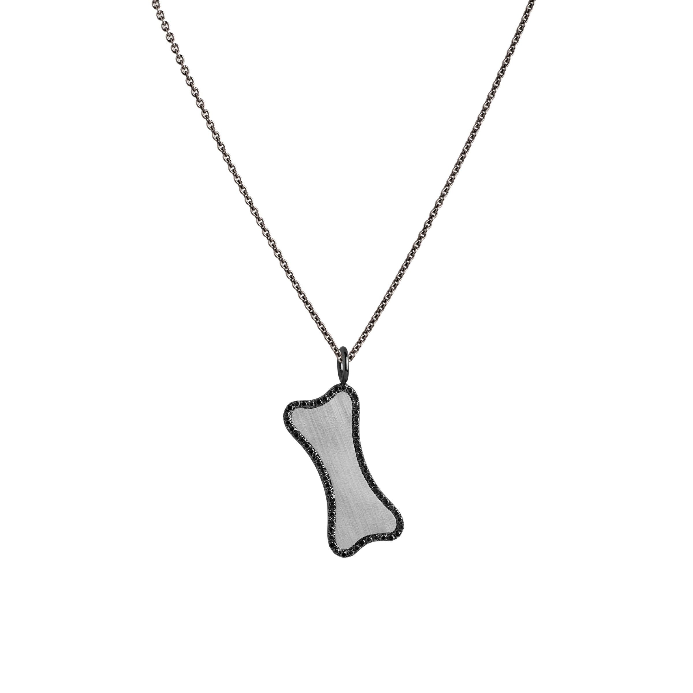 Small Black Diamond Dog Bone Necklace: A sterling silver diamond pendant in the shape of a dog bone, surrounded by black diamonds, displayed on a chain.