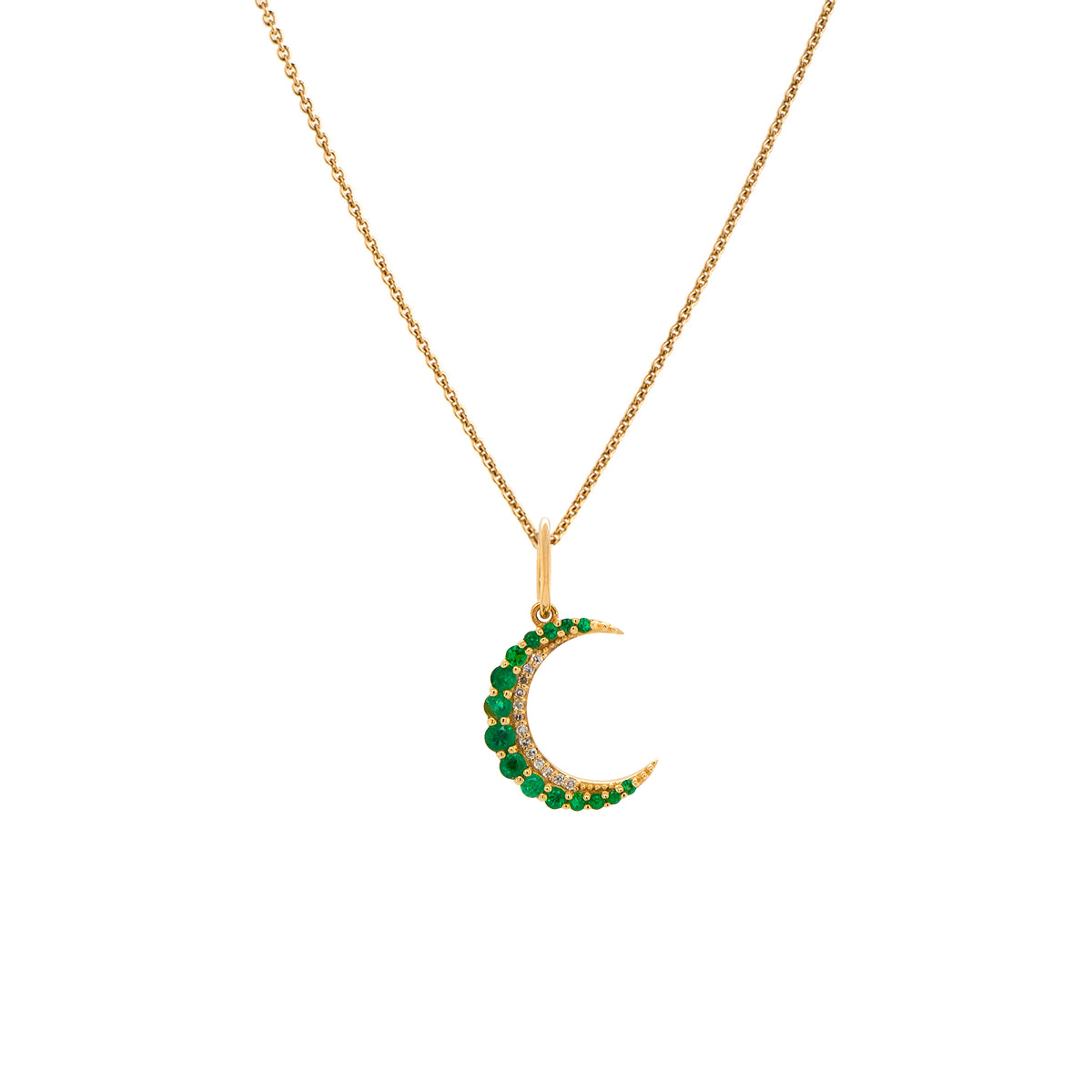 Small Emerald Crescent Necklace: A 14K gold crescent-shaped pendant with emeralds set in a chain.