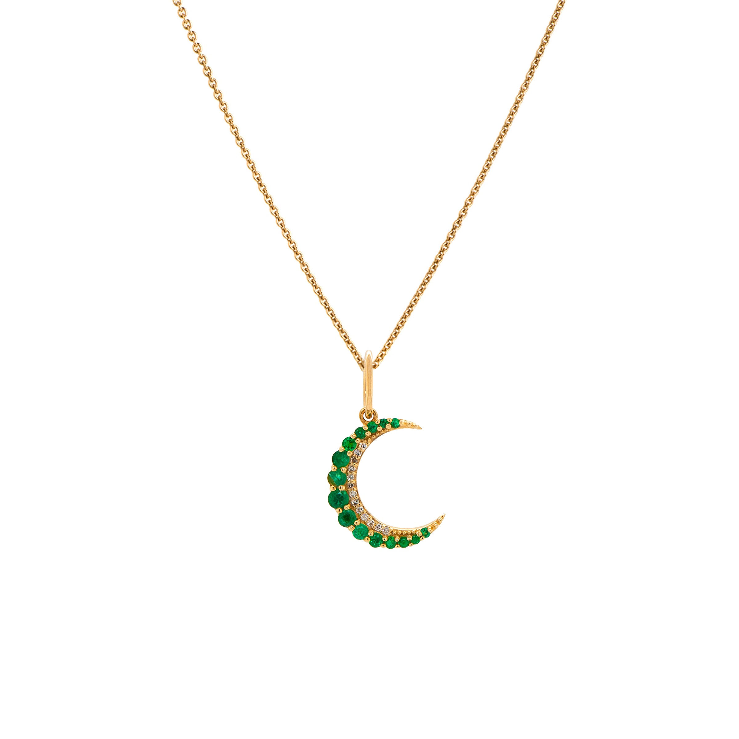 Small Emerald Crescent Necklace: A 14K gold crescent-shaped pendant with emeralds set in a chain.