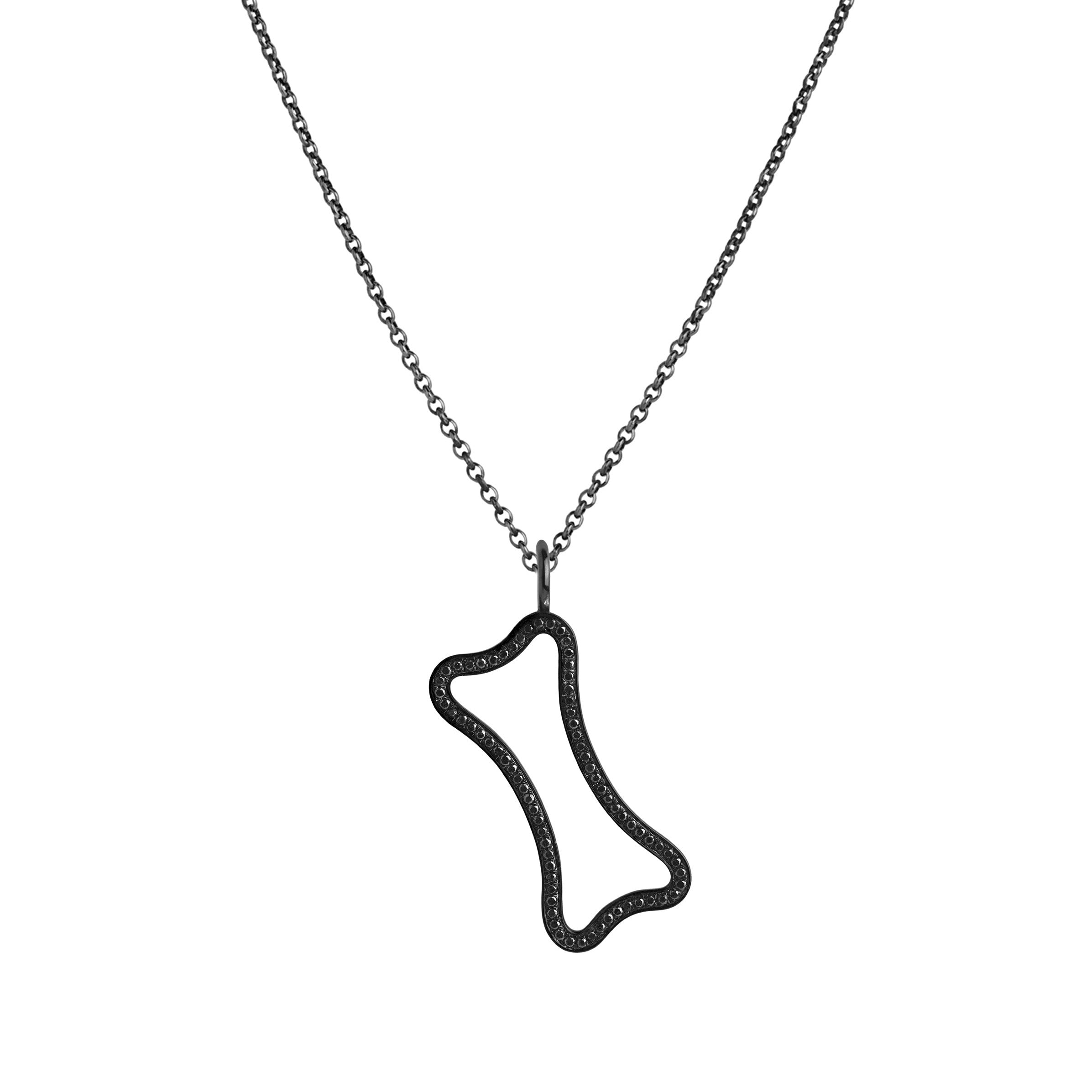 Small Hollow Black Diamond Dog Bone Necklace: A hollow diamond pendant in the outline of a dog bone, embedded in black diamonds, on a chain