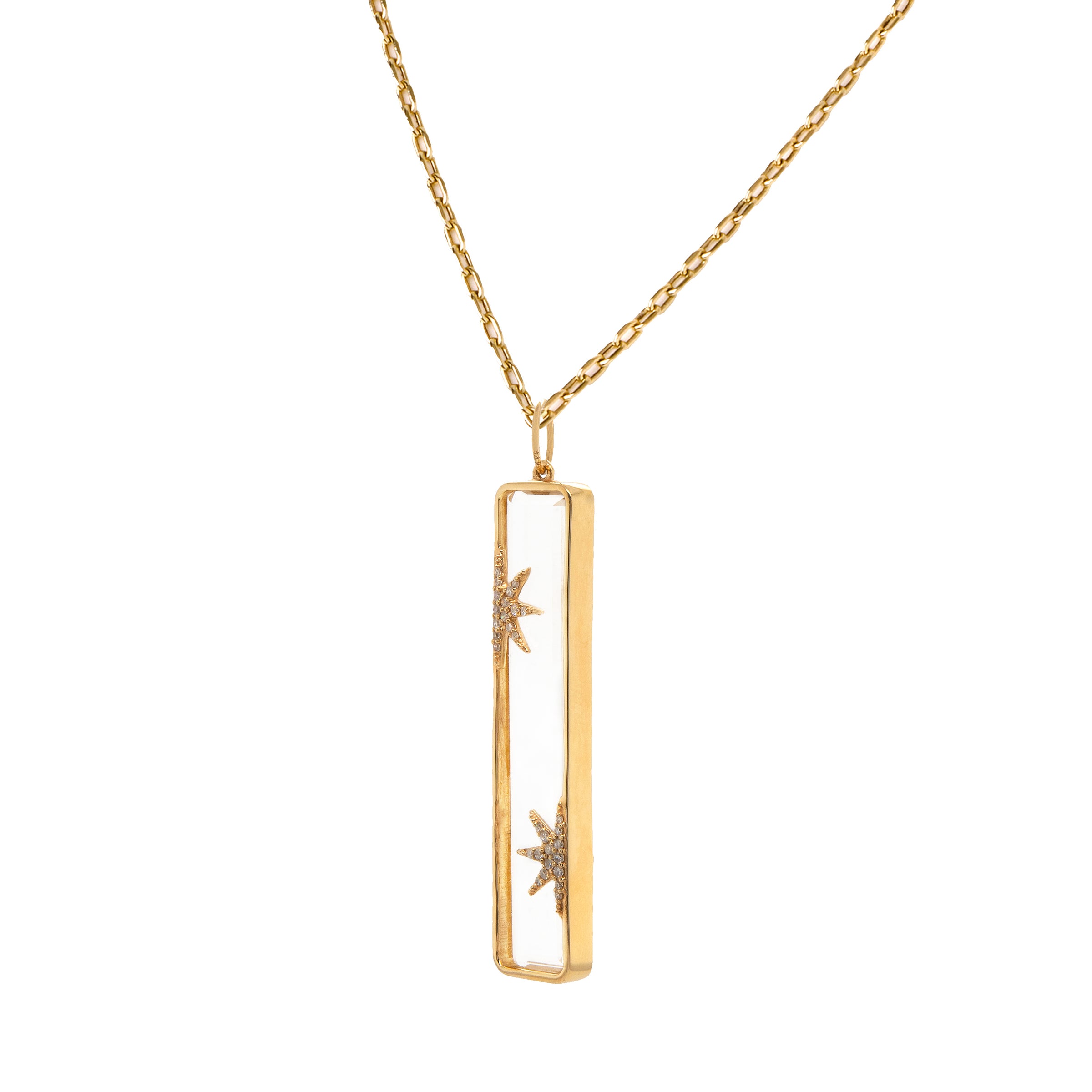 Starry Night Necklace: A 14K gold pendant necklace featuring a clear pendant and half diamond star designs on the Crystal Quartz