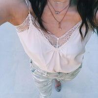 The woman is wearing the Mom Diamond Necklace 