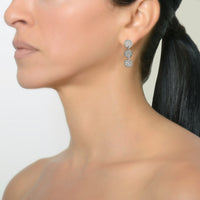 White Gold 3-Dot Earrings on a model