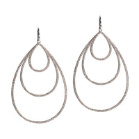 White Gold Small, Medium, & Large Diamond Teardrops: A pair of 14K gold diamond earrings that are a combination of three teardrop design earrings of different sizes, displayed against a white background.