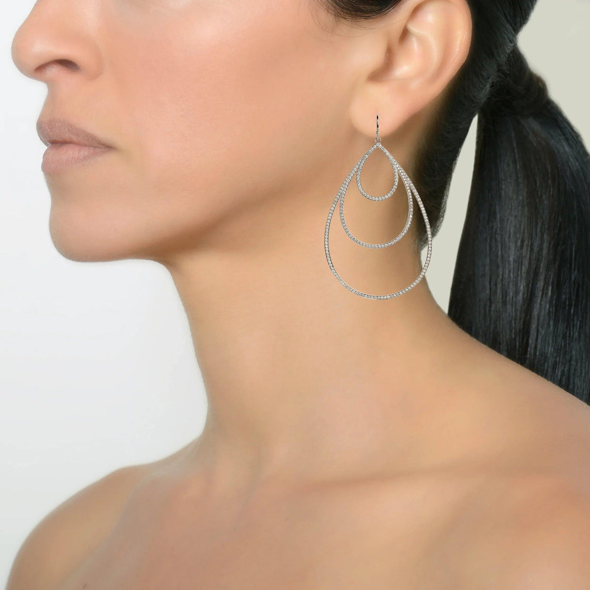 White Gold Small, Medium, & Large Diamond Teardrops on a model