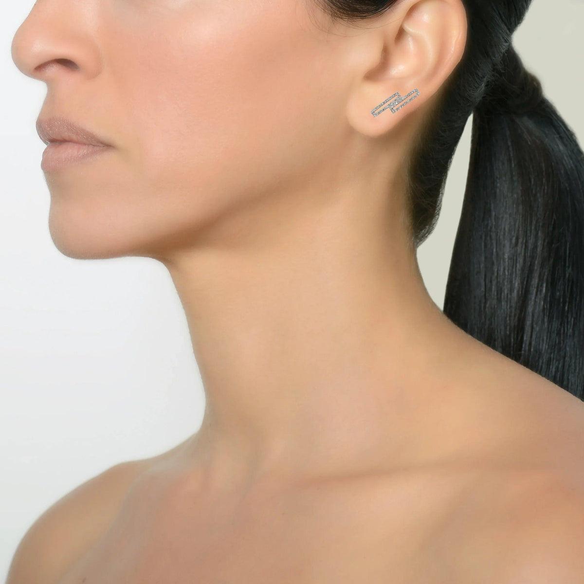 White Gold Staggered Open Bar Diamond Studs on a model