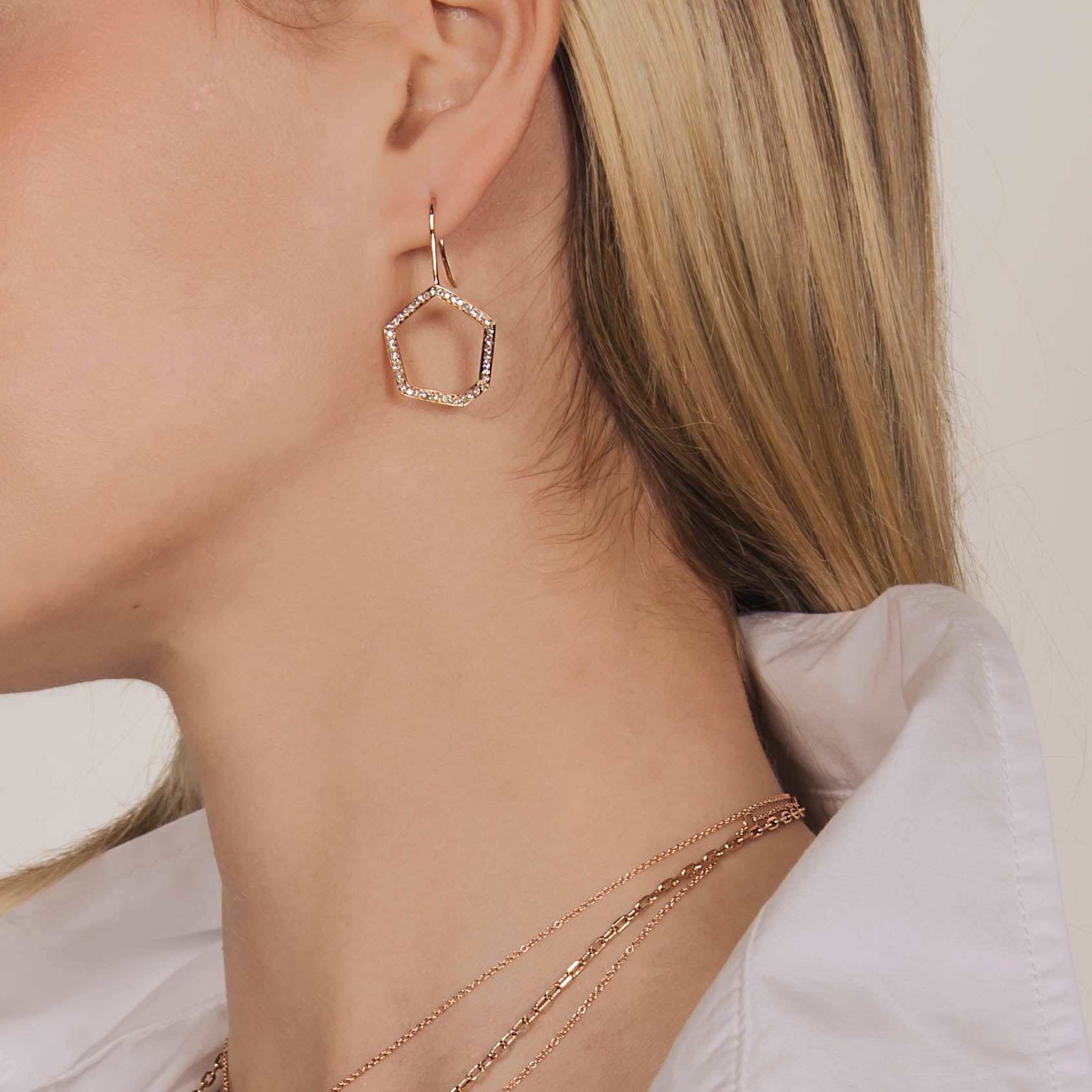 Woman wearing the Hexagon Diamond Drop Earrings