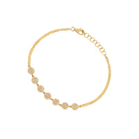 Yellow Gold 7-Dot Diamond Bracelet: A 14K gold bracelet with diamond dots, featuring a lobster clasp fastening.