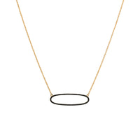 Yellow Gold Reversible Diamond Oval Necklace: A 14K gold necklace featuring an oval of white diamonds on one side and black diamonds on the other, with a lobster clasp fastening.