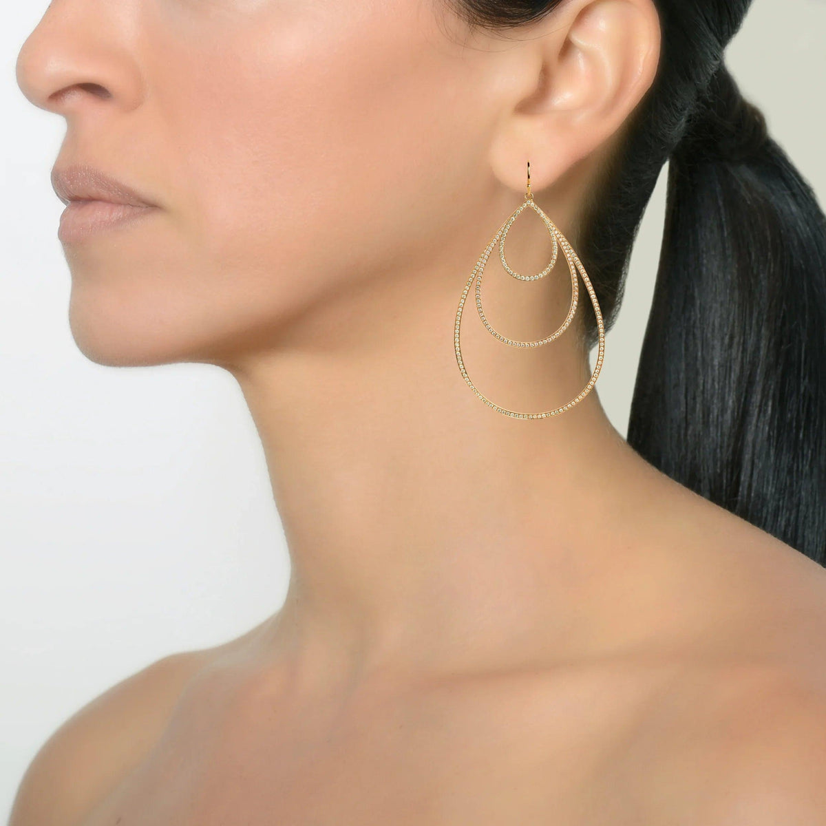 Yellow Gold Small, Medium, & Large Diamond Teardrops on a model