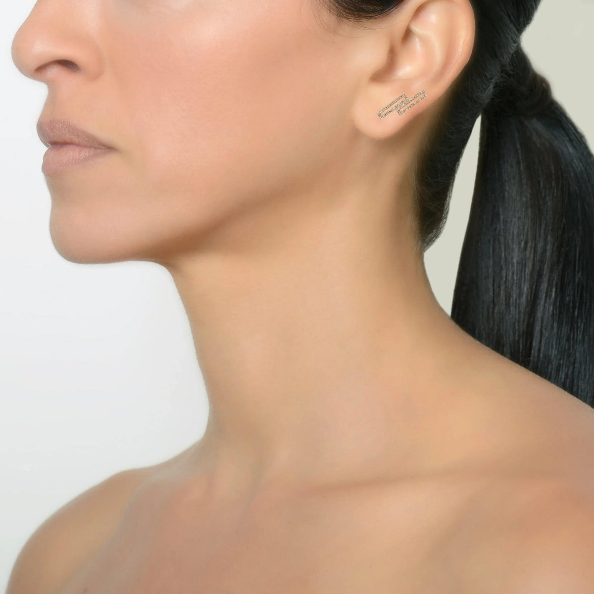 Yellow Gold Staggered Open Bar Diamond Studs on a model
