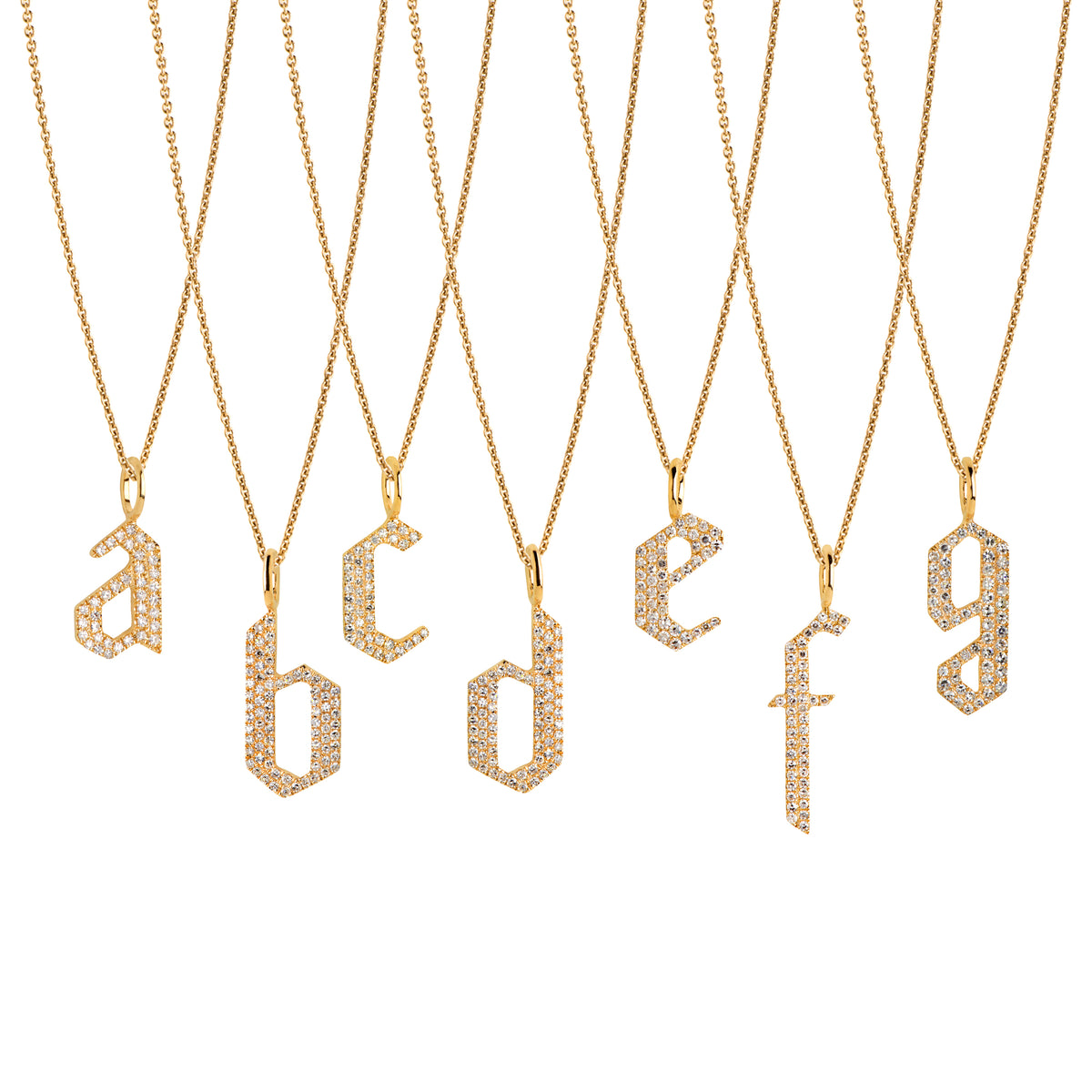 a - g Small White Diamond Alphabet Necklaces: A series of 14K gold necklaces with white diamond letters, adjustable in length and featuring a lobster clasp fastening.