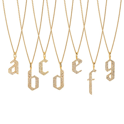 a - g Small White Diamond Alphabet Necklaces: A series of 14K gold necklaces with white diamond letters, adjustable in length and featuring a lobster clasp fastening.