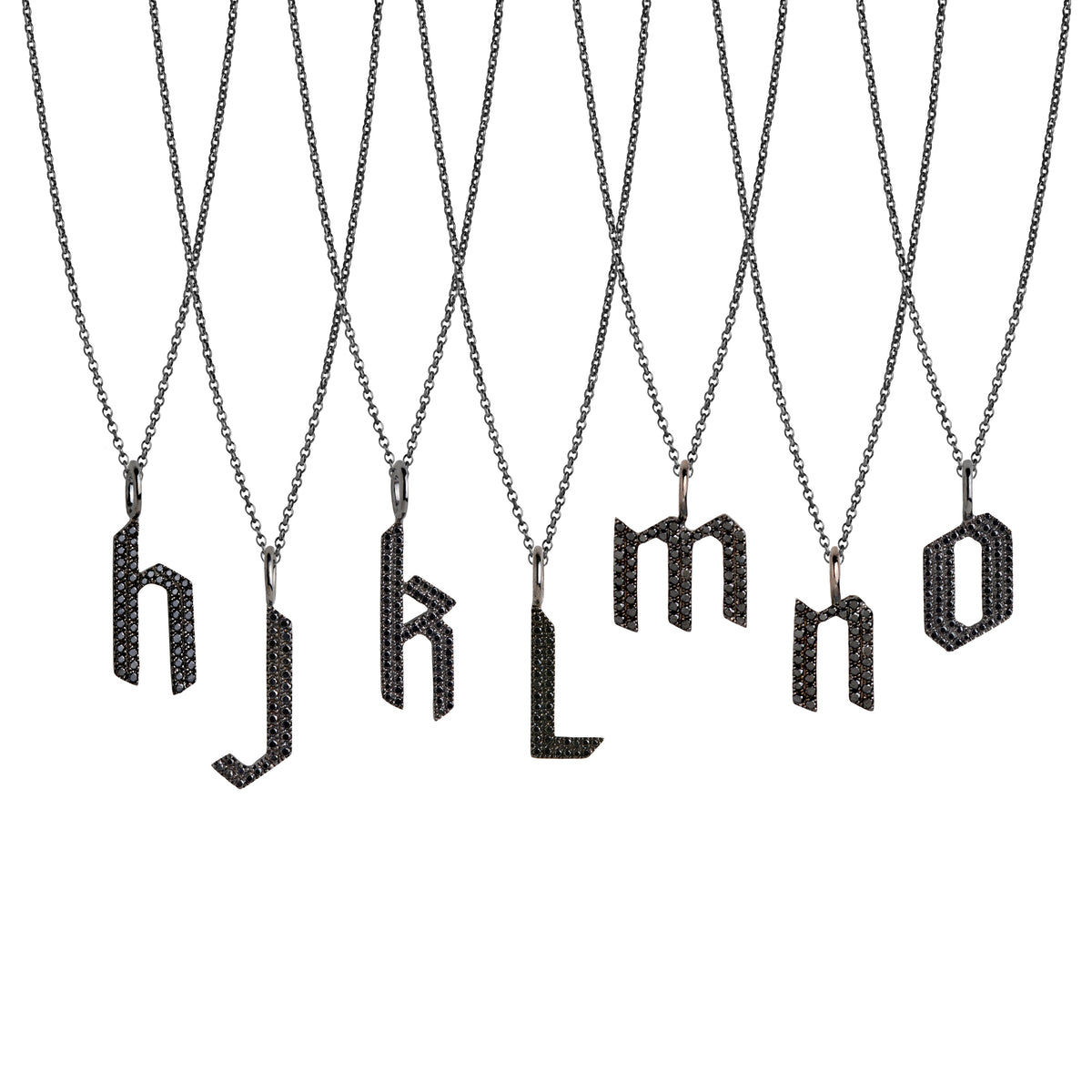h - o Small Black Diamond Alphabet Necklaces: A series of oxidized sterling silver necklaces with black diamond letters, adjustable in length and featuring a lobster clasp fastening.