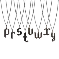 p - y Small Black Diamond Alphabet Necklaces: A series of oxidized sterling silver necklaces with black diamond letters, adjustable in length and featuring a lobster clasp fastening.