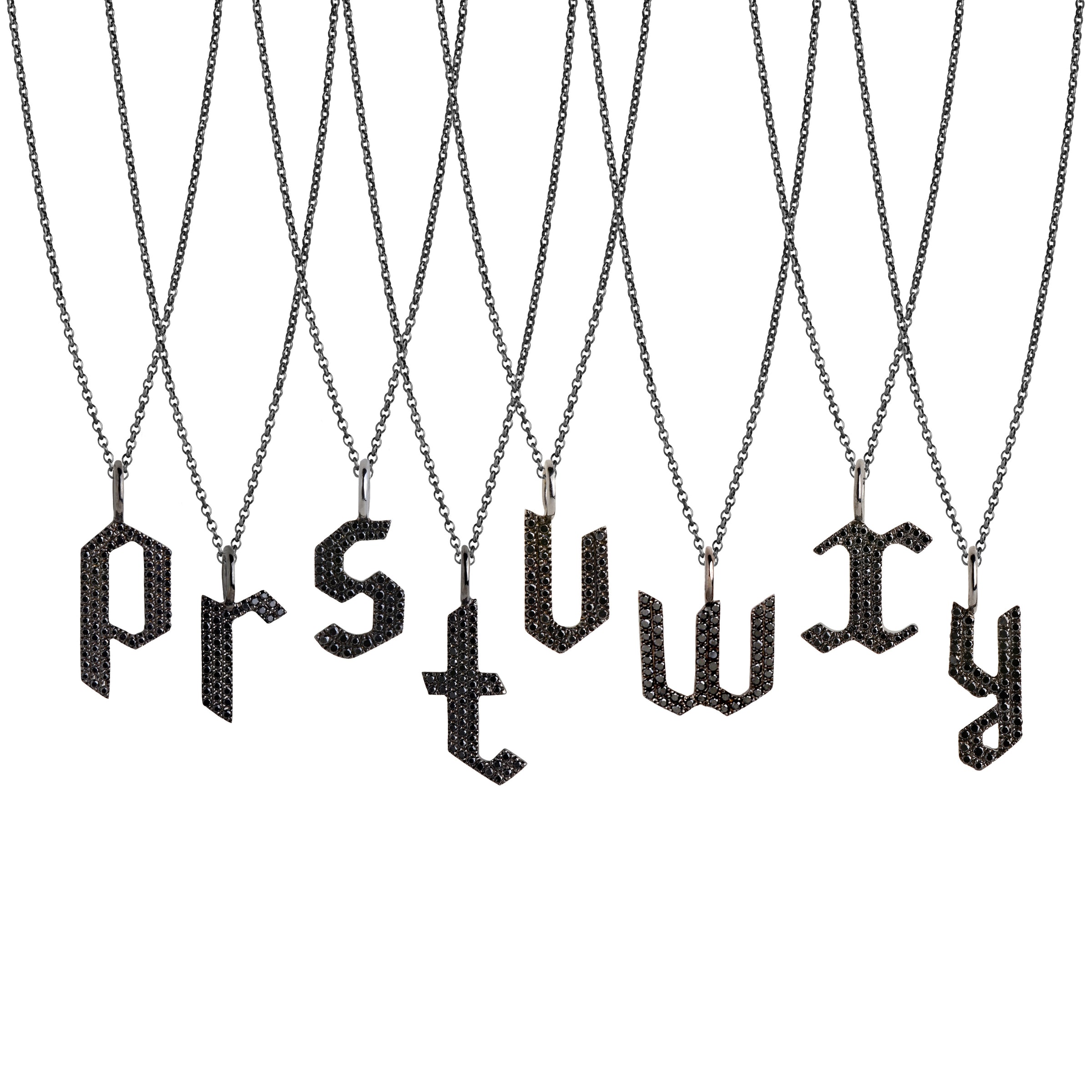p - y Small Black Diamond Alphabet Necklaces: A series of oxidized sterling silver necklaces with black diamond letters, adjustable in length and featuring a lobster clasp fastening.