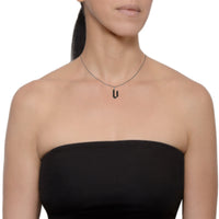 "v" Small Black Diamond Alphabet Necklace on a model